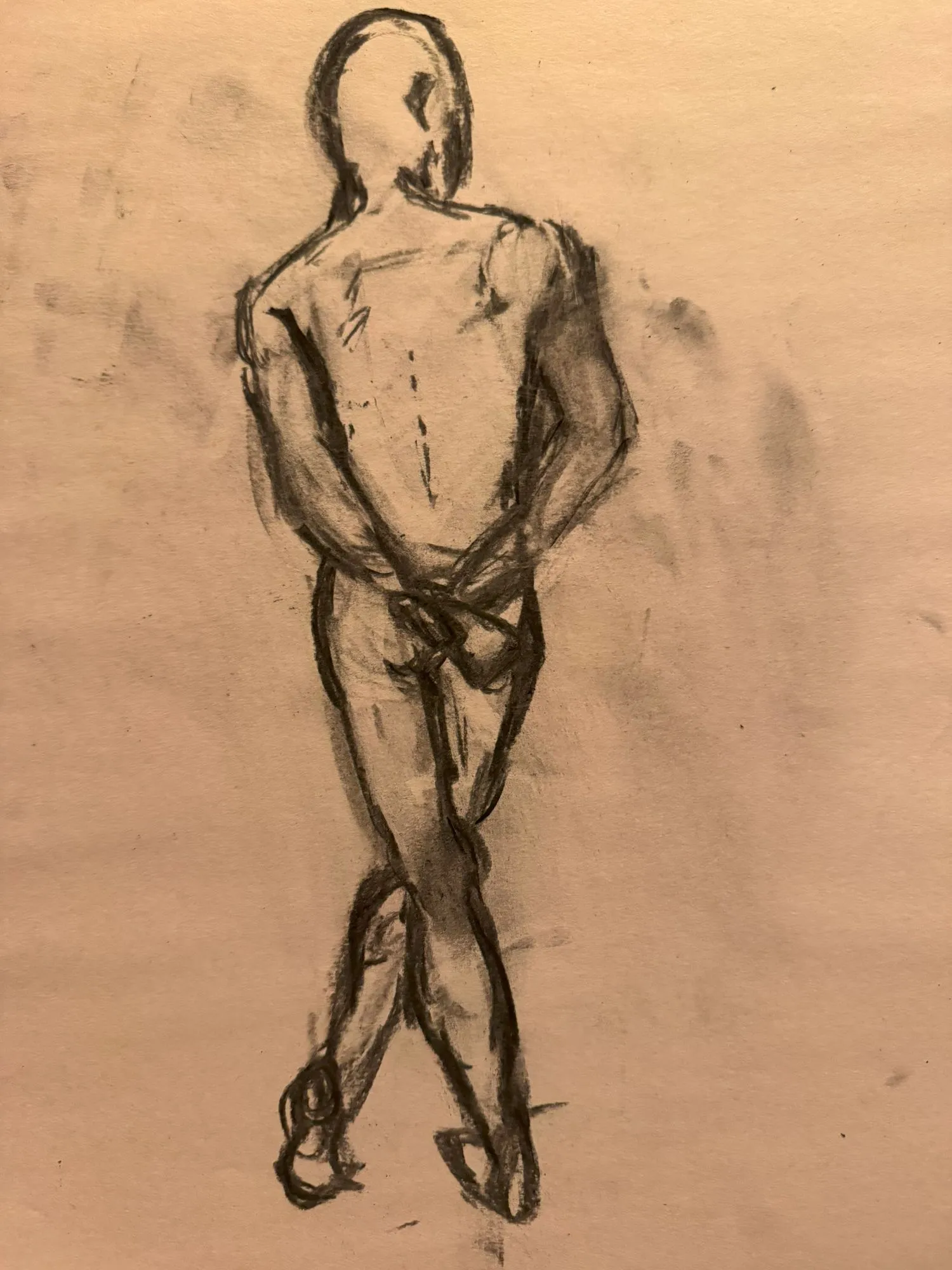 A figure drawn in charcoal