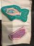 Two stamps shaped like a fish and the fish's scales
