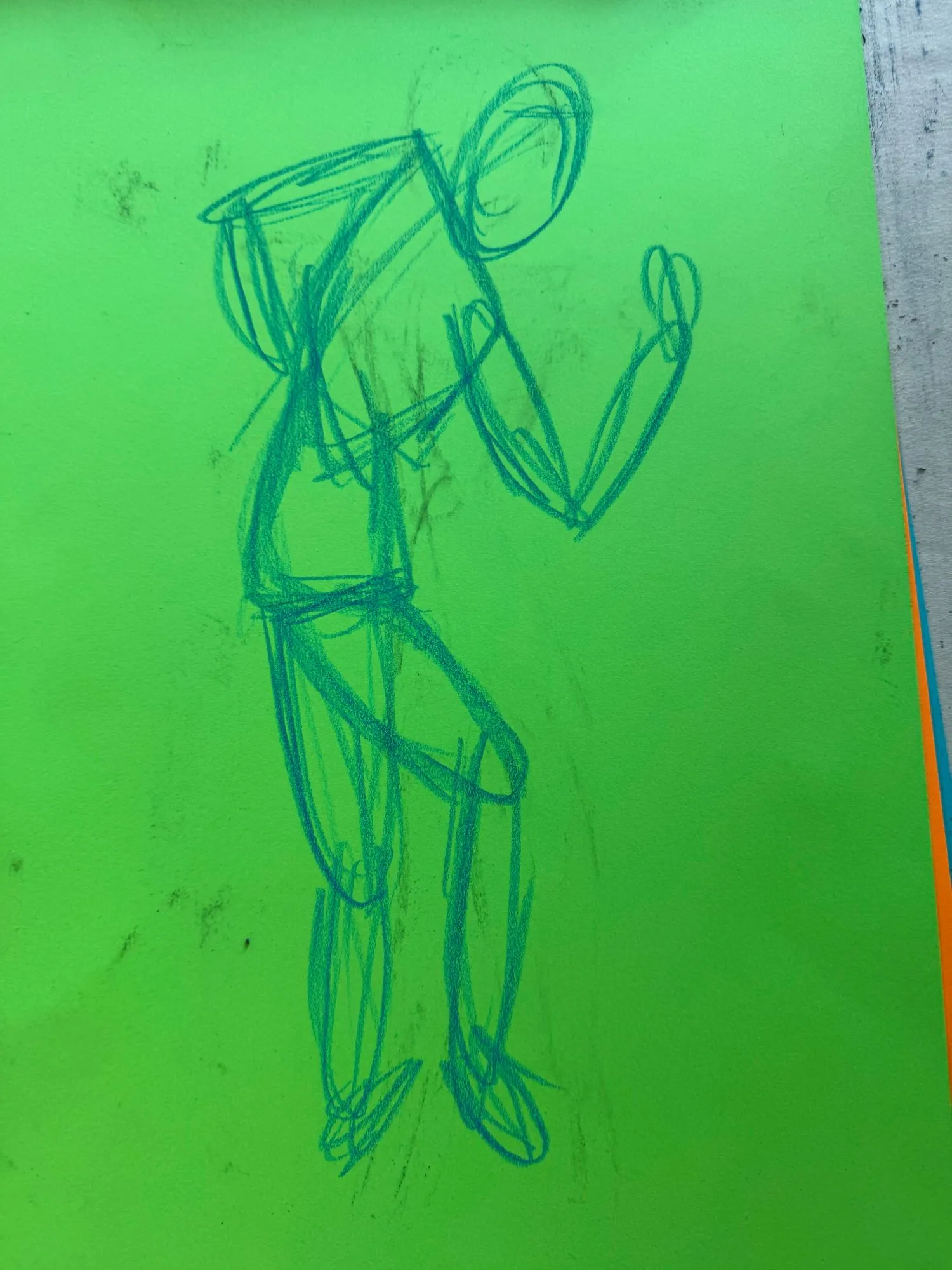 A quickly-drawn figure in blue pastel on green paper