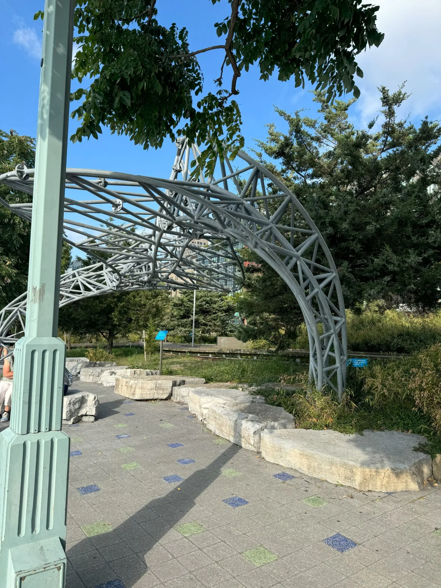 A metal structure over a sidewalk