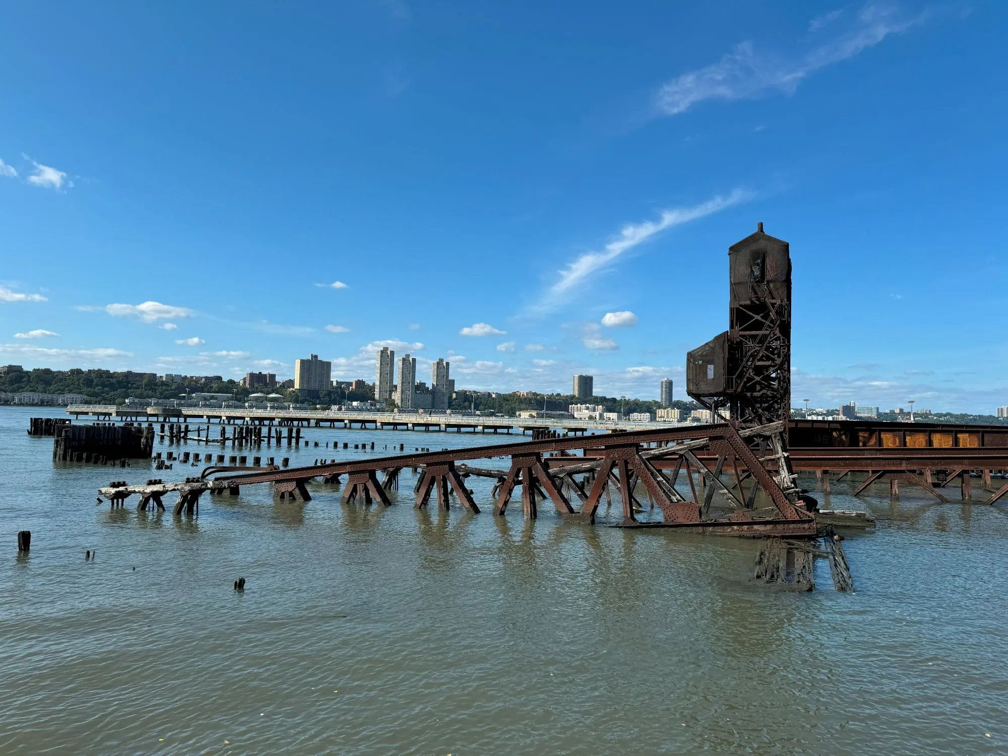 A broken down wood and metal structure in the water