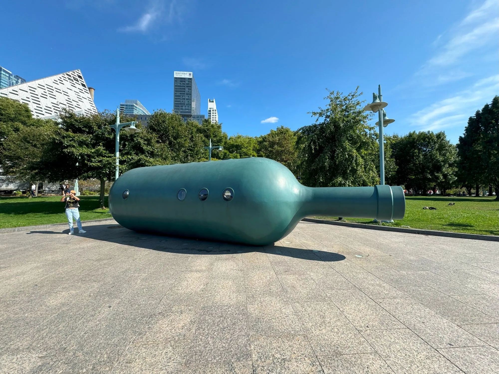 A large statue of a bottle on its side