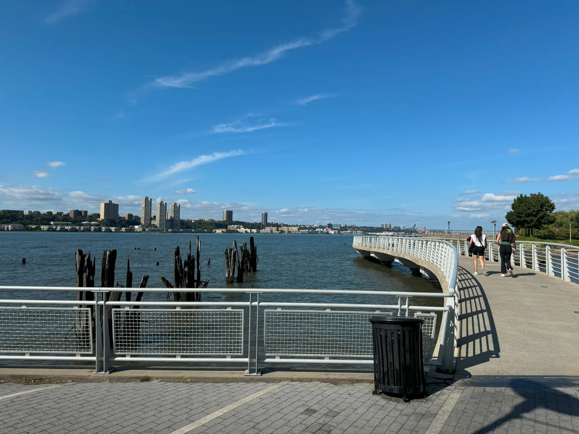 A shiny new pier alongside broken wooden posts