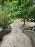 A picture from the top of an outdoor staircase on a rainy day