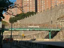A pedestrian bridge with a sign saying 'Our Community is Our Strength'