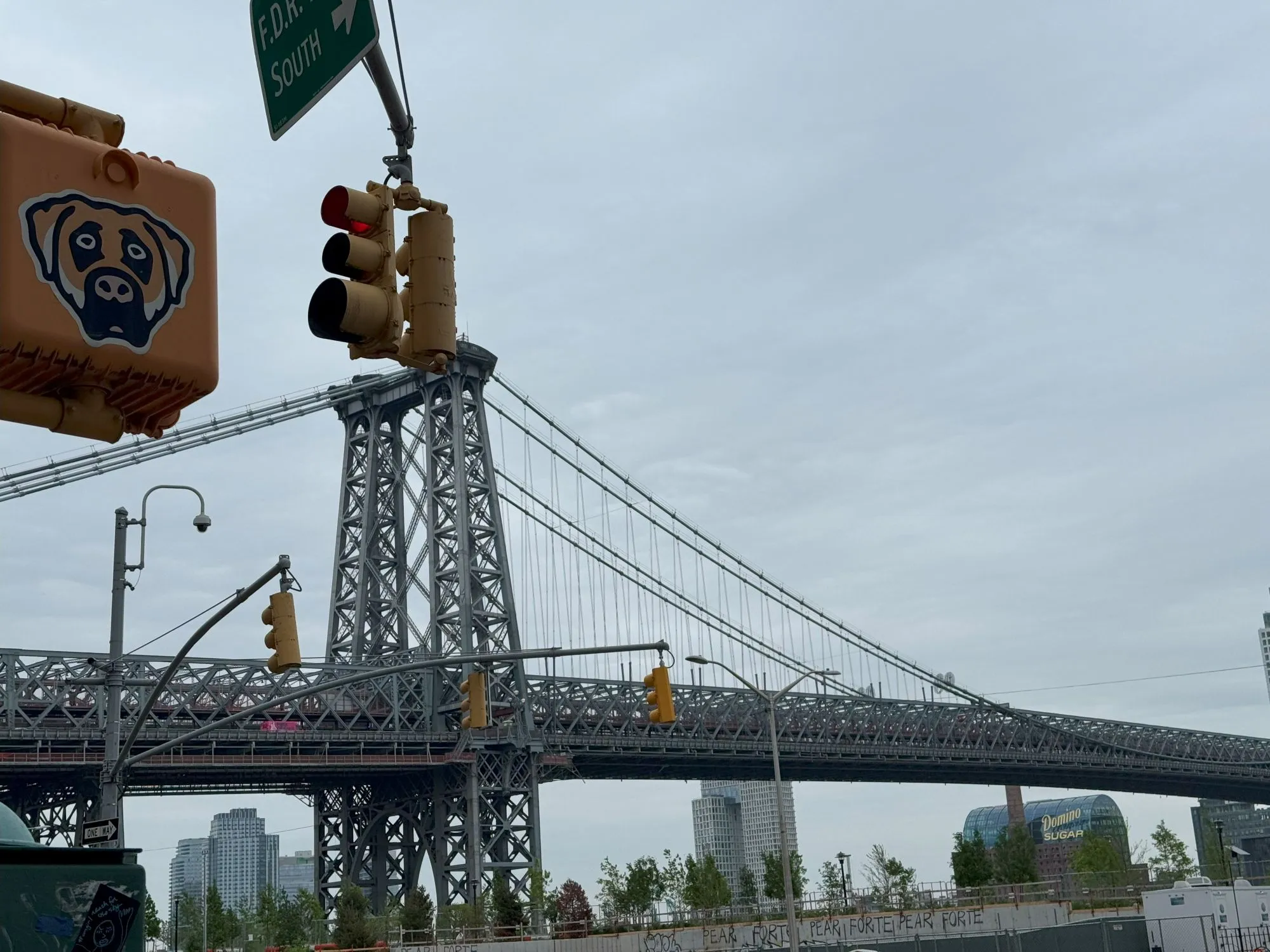 The Williamsburg Bridge with the Domino Sugar sign visible in the distance