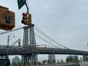 The Williamsburg Bridge with the Domino Sugar sign visible in the distance